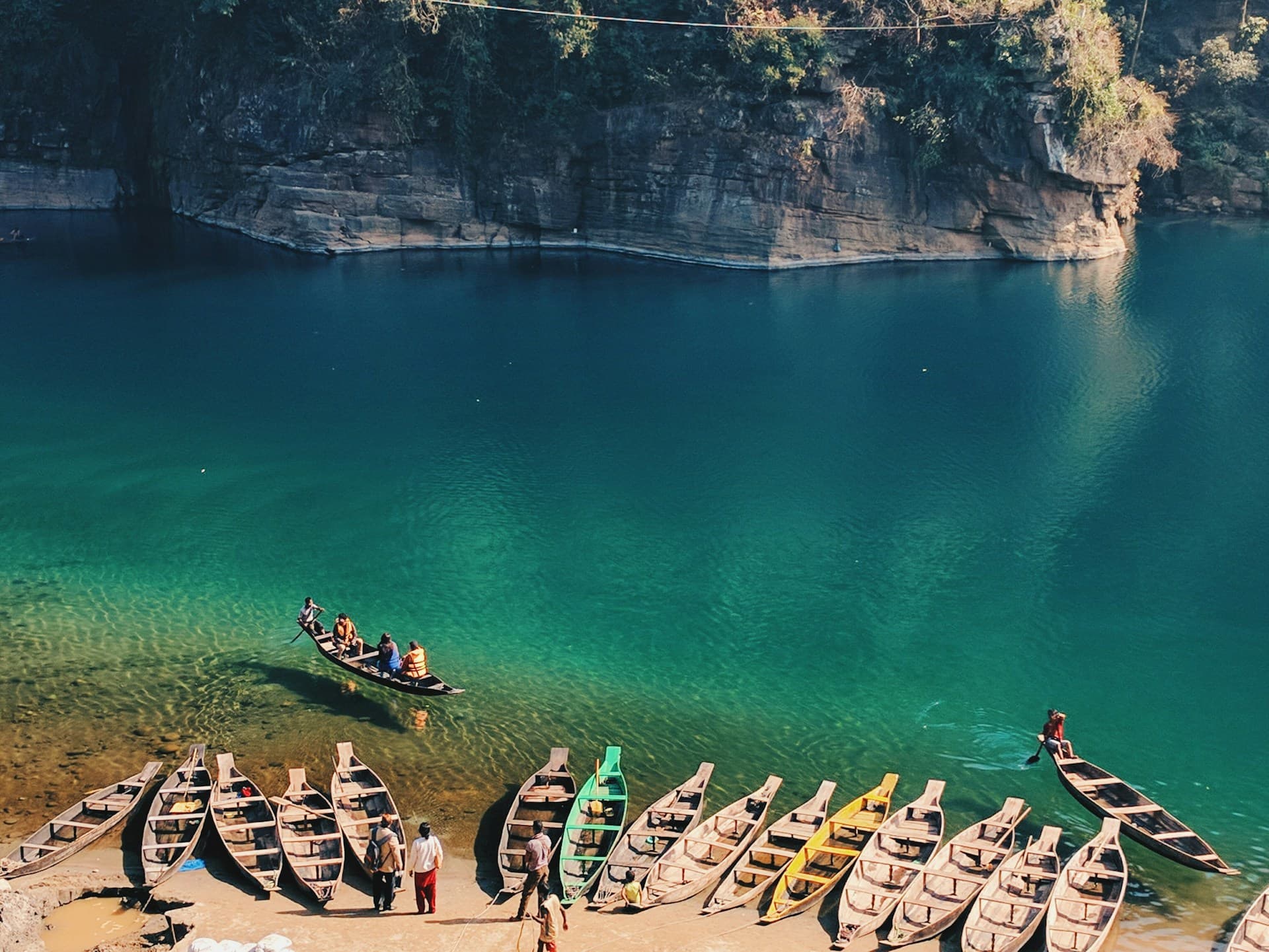 Crystal-clear river and boats in Meghalaya